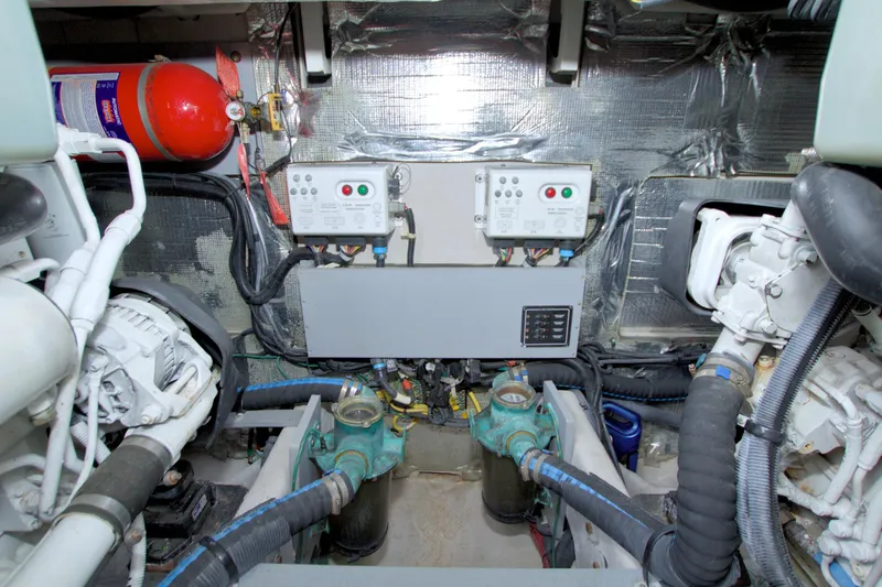 Slide: The Image of Engine room of 2013 Meridian 441 Sedan with control panels and fire extinguisher. - 76