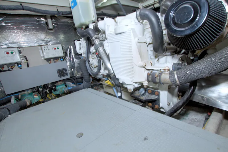 Slide: The Image of Engine room of a 2013 Meridian 441 Sedan yacht, showcasing mechanical components. - 81
