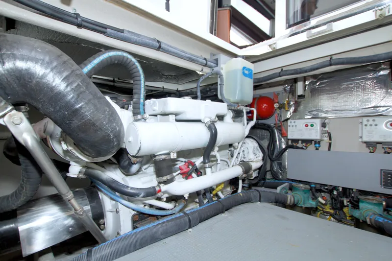 Slide: The Image of Engine room of 2013 Meridian 441 Sedan yacht, showcasing mechanical components and systems. - 94