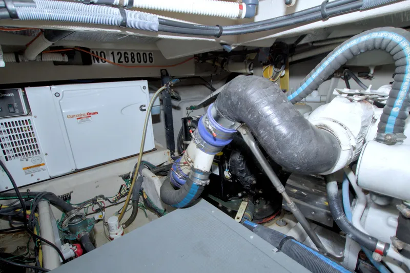 Slide: The Image of Engine room of 2013 Meridian 441 Sedan with Cummins Onan generator and hoses. - 96