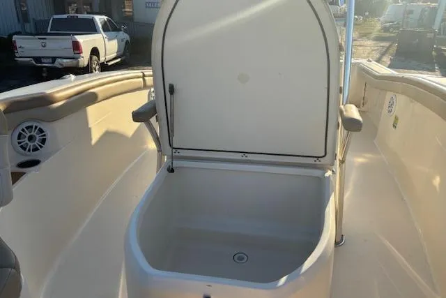 Slide: The Image of 2022 Scout 215 XSF boat with open storage compartment on deck. - 14