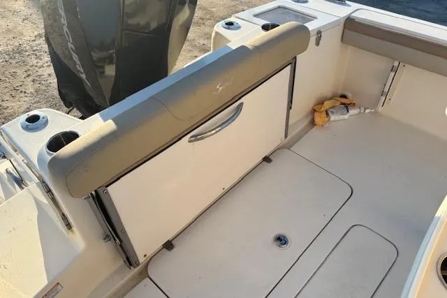 Slide: The Image of 2022 Scout 215 XSF boat interior with seating and storage compartments. - 17