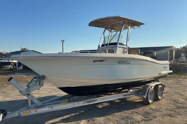 Slide: The Image of 2022 Scout 215 XSF boat on trailer, side view, sunny day. - 5