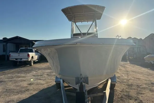 Slide: The Image of 2022 Scout 215 XSF boat on trailer, sunlit background. - 6