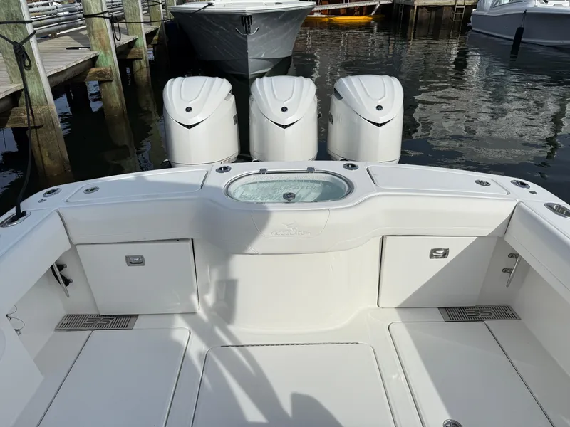 Slide: The Image of 2025 Regulator 35 boat with triple engines docked at marina. - 17