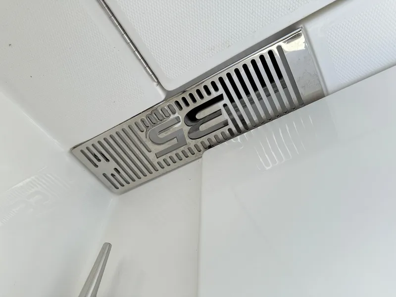 Slide: The Image of 2025 Regulator 35 boat interior detail with sleek metal vent design. - 19