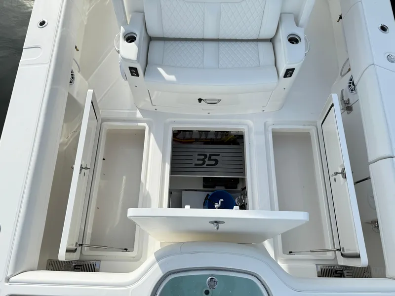 Slide: The Image of 2025 Regulator 35 boat interior with storage compartments and seating. - 21