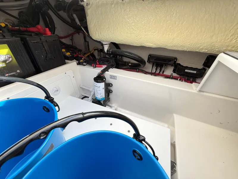 Slide: The Image of Interior view of a 2025 Regulator 35 boat, featuring equipment and blue buckets. - 25