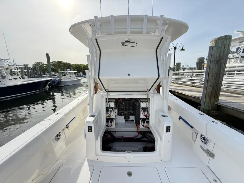 Slide: The Image of 2025 Regulator 35 boat with open console, docked at marina. - 29