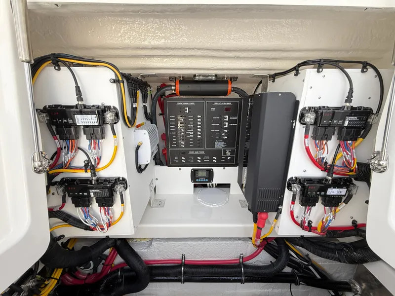Slide: The Image of Electrical system of a 2025 Regulator 35 boat, showcasing wiring and control panels. - 30
