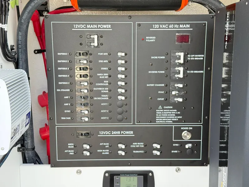 Slide: The Image of Electrical panel on 2025 Regulator 35 boat, featuring 12VDC and 120VAC power controls. - 31