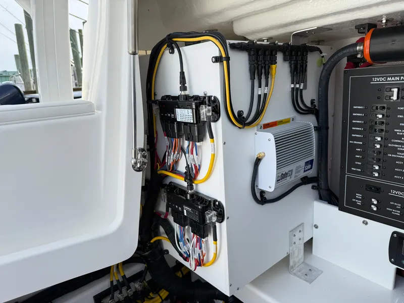 Slide: The Image of Electrical panel of 2025 Regulator 35 boat, showcasing wiring and components. - 32