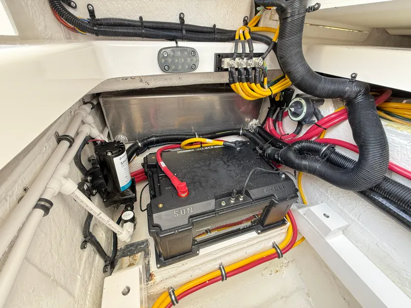 Slide: The Image of Battery compartment of 2025 Regulator 35 boat with wiring and connections. - 36