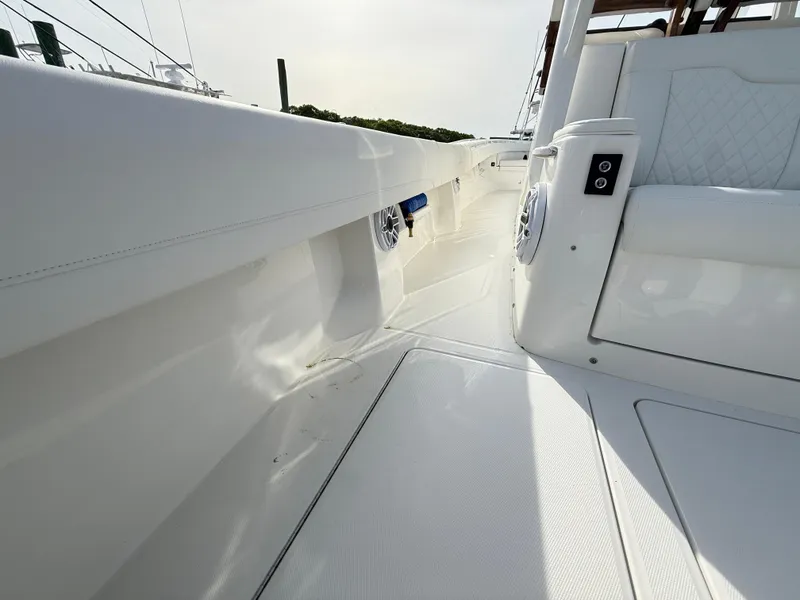 Slide: The Image of 2025 Regulator 35 boat interior with white seating and sleek design. - 37