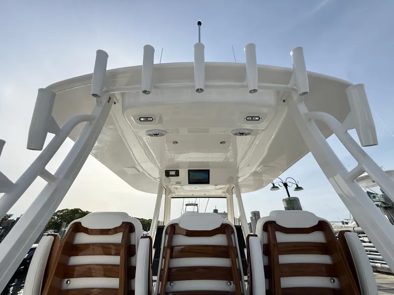 Slide: The Image of 2025 Regulator 35 boat, view of helm seating and overhead structure. - 44