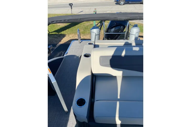 Slide: The Image of 2022 Barletta Cabrio 22UC pontoon boat interior with seating and cup holders. - 12