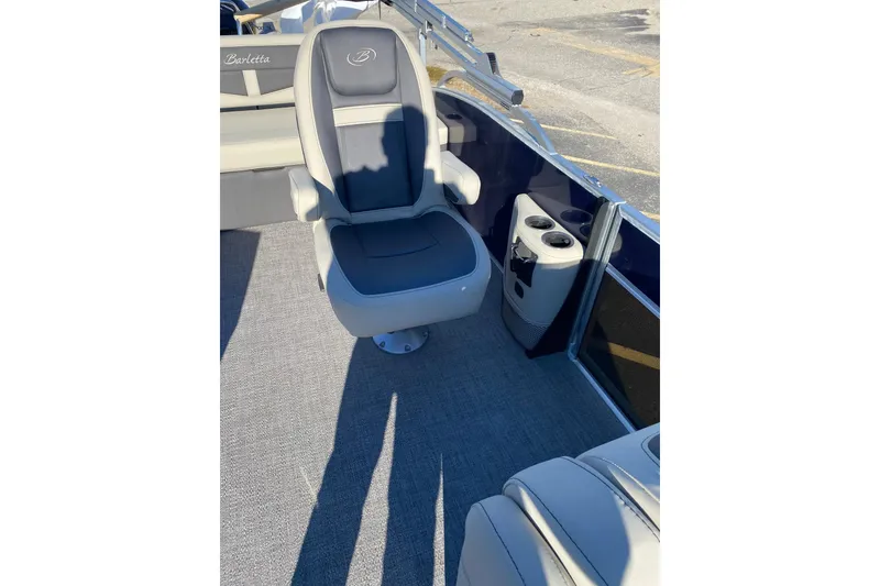 Slide: The Image of 2022 Barletta Cabrio 22UC boat interior with gray seating and cup holders. - 14