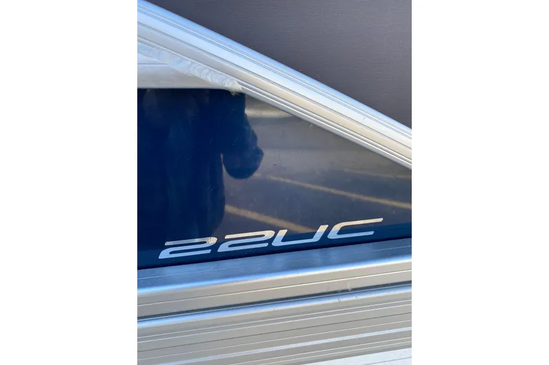 Slide: The Image of 2022 Barletta Cabrio 22UC boat model emblem on metallic surface. - 17