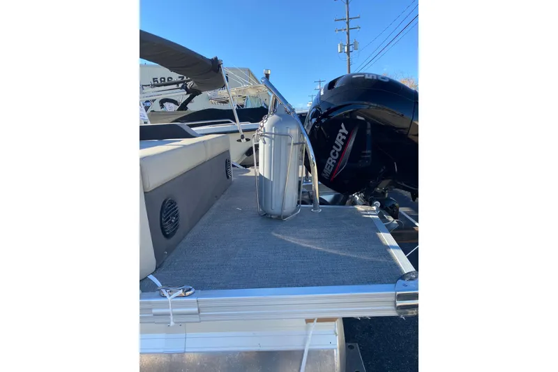 Slide: The Image of 2022 Barletta Cabrio 22UC pontoon boat with Mercury engine, rear deck view. - 18