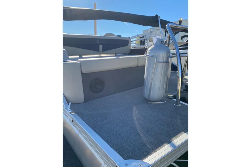 Slide: The Image of 2022 Barletta Cabrio 22UC pontoon boat interior with seating and safety equipment. - 19