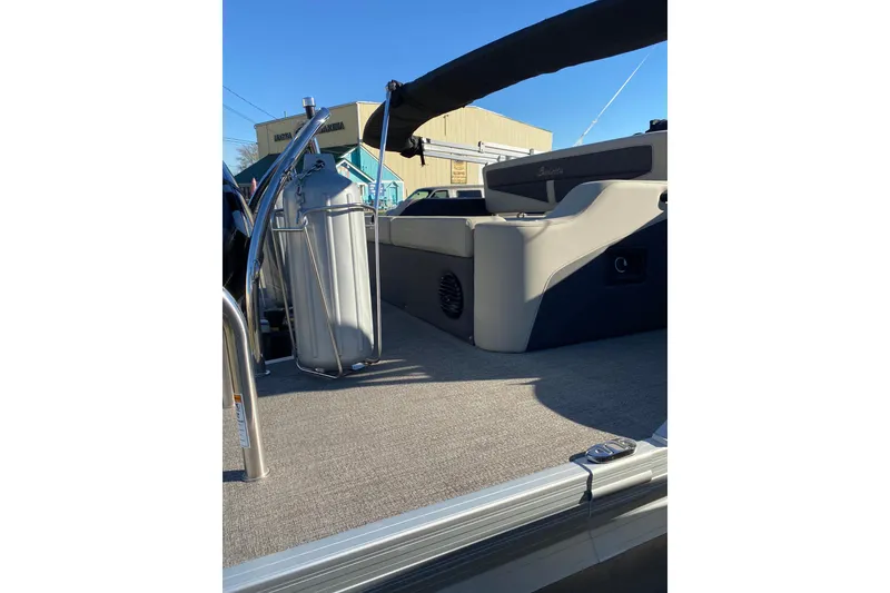 Slide: The Image of 2022 Barletta Cabrio 22UC pontoon boat interior with seating and railing. - 22