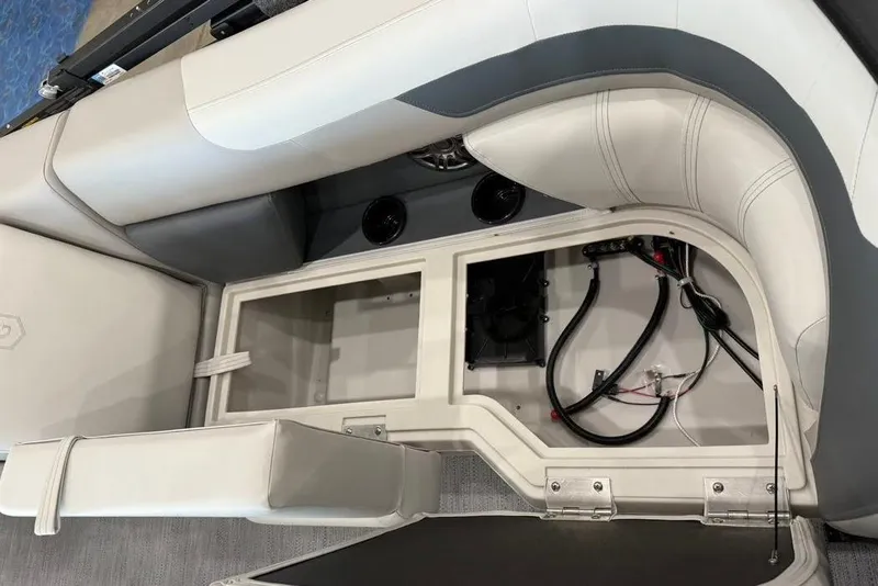 Slide: The Image of Interior view of 2026 Godfrey SWEETWATER 2286 SB boat, showcasing storage compartment and wiring. - 14