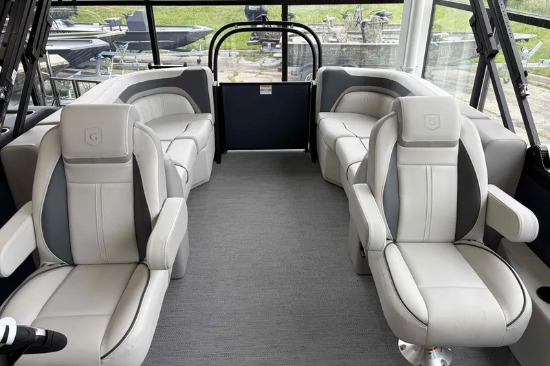 Slide: The Image of 2026 Godfrey SWEETWATER 2286 SB boat interior with steering console and captain's chair. - 20
