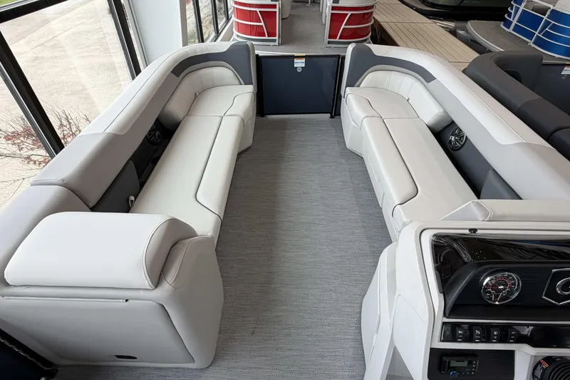 Slide: The Image of 2026 Godfrey SWEETWATER 2286 SB boat dashboard with steering wheel and gauges. - 21