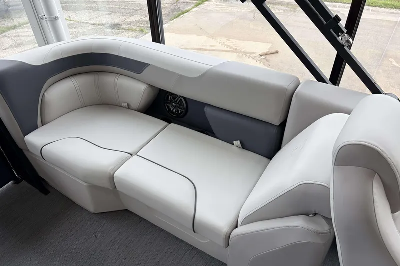 Slide: The Image of Interior view of 2026 Godfrey SWEETWATER 2286 SB boat, showcasing storage compartment and wiring. - 24