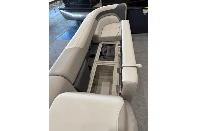 Slide: The Image of 2026 Godfrey SWEETWATER 2286 SB boat interior with open storage compartment. - 6