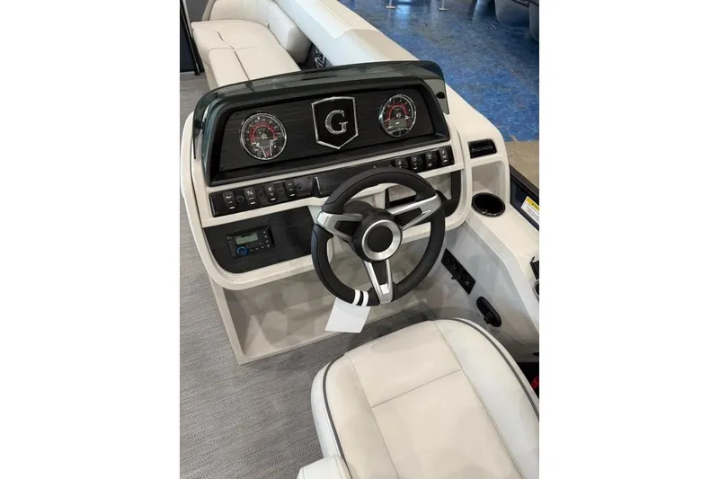 Slide: The Image of 2026 Godfrey SWEETWATER 2286 SB boat dashboard with steering wheel and gauges. - 8