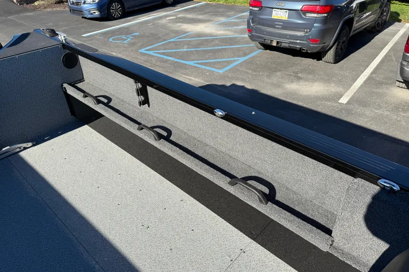 Slide: The Image of Interior view of 2026 Crestliner 2050 Commander Elite boat, showcasing storage compartments. - 15