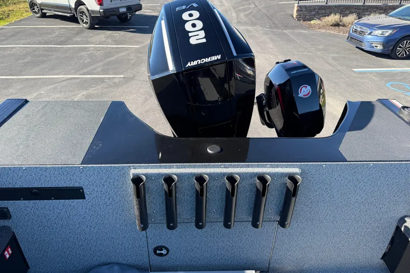 Slide: The Image of 2026 Crestliner 2050 Commander Elite boat with Mercury outboard engines in a parking lot. - 19