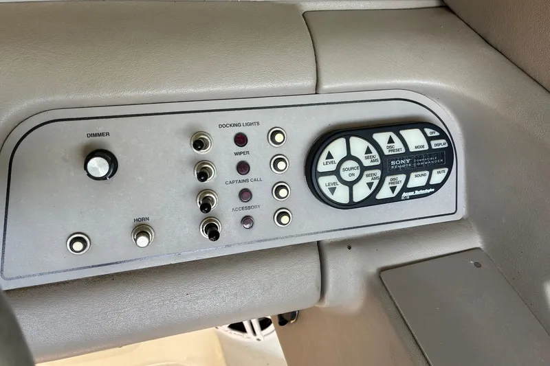 Slide: The Image of Control panel of a 2000 Cobalt 246 boat with switches and Sony remote. - 11