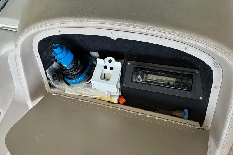 Slide: The Image of Storage compartment in a 2000 Cobalt 246 boat with a Sony stereo and accessories. - 15