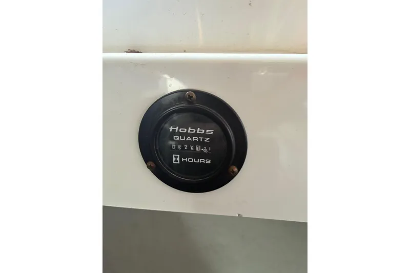 Slide: The Image of Hour meter on 2000 Cobalt 246 boat, displaying usage hours. - 18