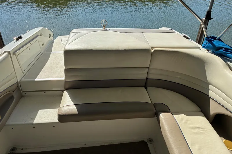 Slide: The Image of Interior seating of a 2000 Cobalt 246 boat with water view. - 6