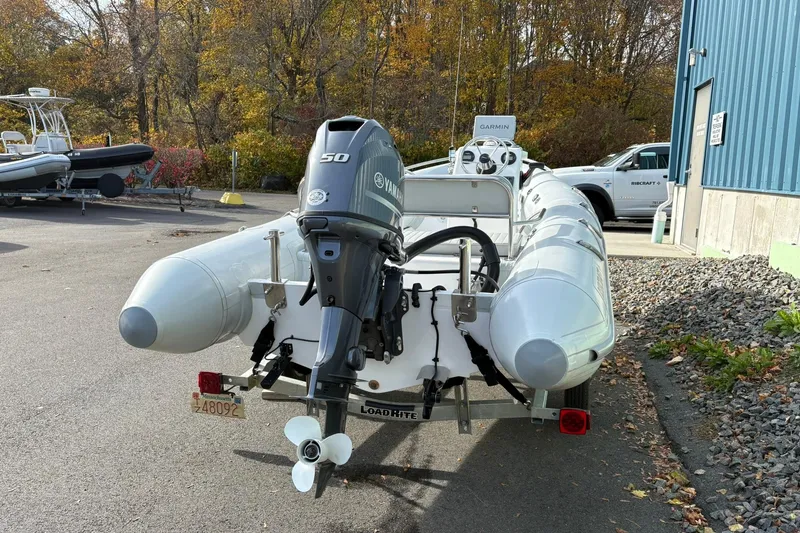Slide: The Image of 2024 Ribcraft 4.8T inflatable boat with Yamaha outboard motor on trailer. - 15