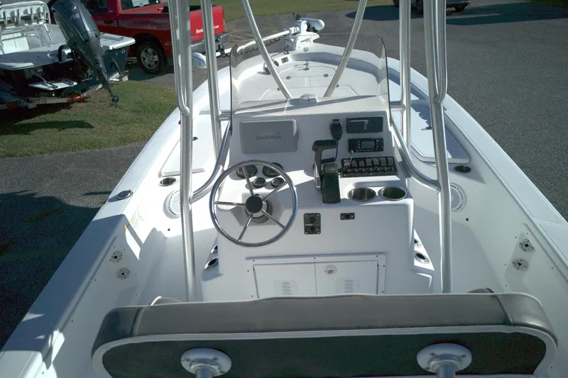 Slide: The Image of 2017 Frontier 2104 boat interior with steering wheel and control panel. - 10