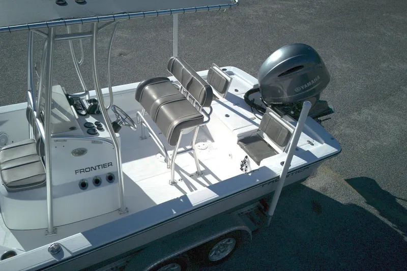 Slide: The Image of 2017 Frontier 2104 boat with Yamaha engine, featuring seating and control console. - 4