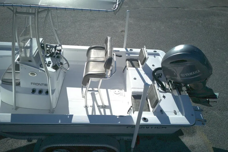 Slide: The Image of 2017 Frontier 2104 boat with Yamaha outboard motor, featuring seating and control console. - 5