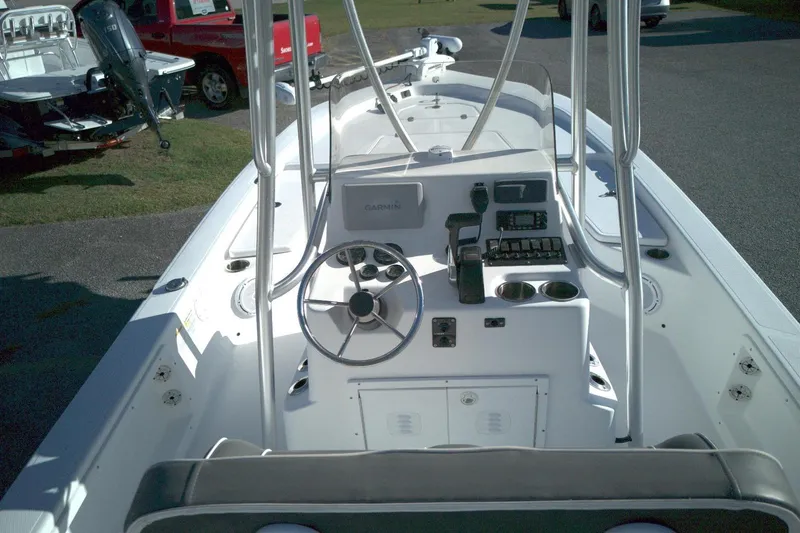 Slide: The Image of 2017 Frontier 2104 boat interior with steering wheel and control panel. - 9