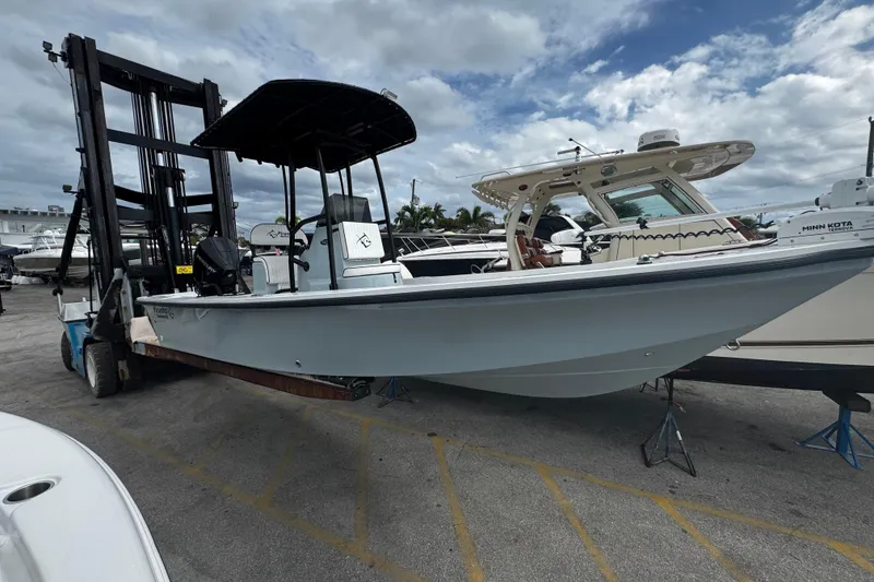 The Image of 2026 Piranha Casador B2200 boat on forklift, displayed outdoors under cloudy sky. - 0