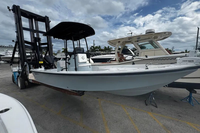 Slide: The Image of 2026 Piranha Casador B2200 boat on forklift, marina background, cloudy sky. - 1