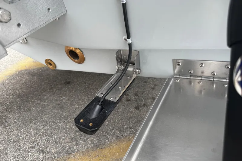 Slide: The Image of Close-up of Piranha Casador B2200 boat component, featuring a metal hinge and wiring, 2026 model. - 14