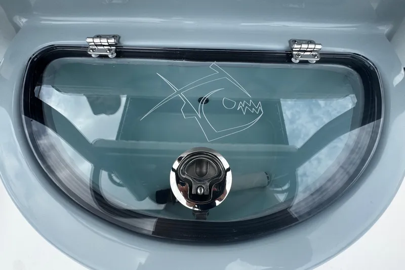 Slide: The Image of 2026 Piranha Casador B2200 boat hatch with fish logo and secure latch. - 15