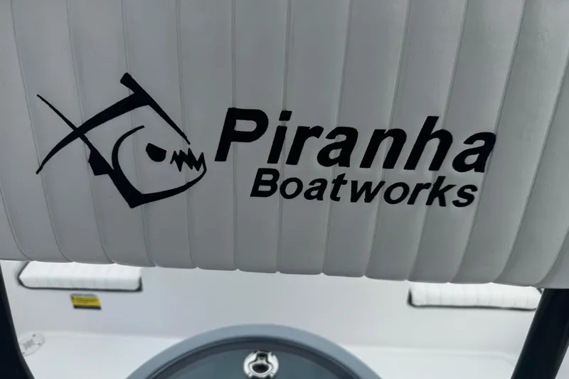 Slide: The Image of Piranha Boatworks logo on 2026 Casador B2200 boat seat. - 17