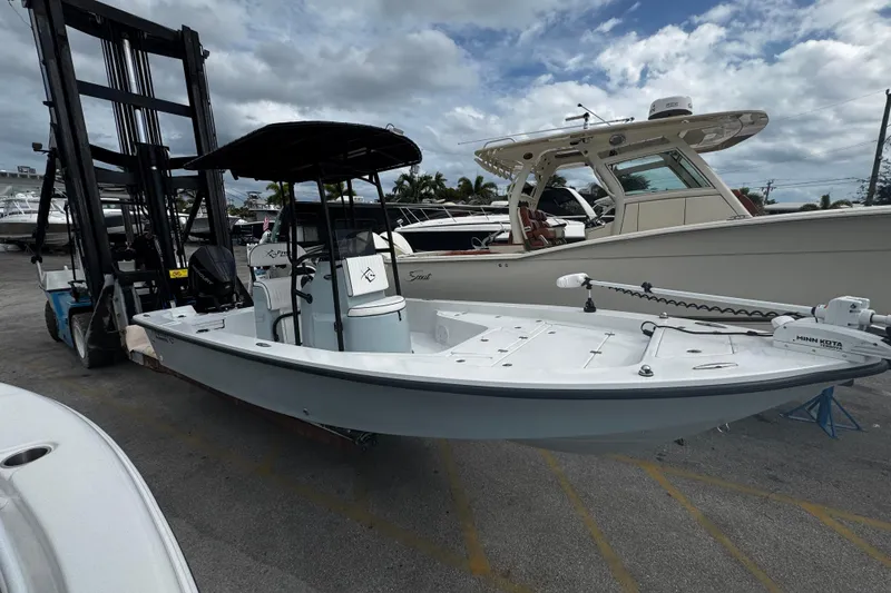 Slide: The Image of 2026 Piranha Casador B2200 boat on forklift, marina background, cloudy sky. - 3