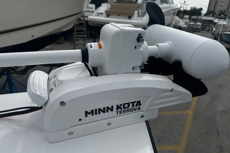 Slide: The Image of Minn Kota Terrova motor on Piranha Casador B2200, 2026 model, in a marina setting. - 32