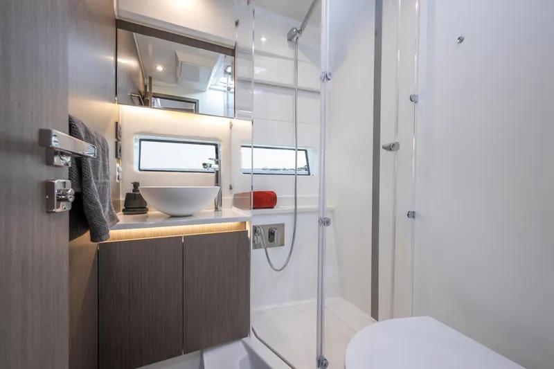 Slide: The Image of Modern bathroom interior of 2026 Jeanneau NC1295 Coupe yacht, featuring sleek design elements. - 15